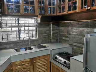 SINGLE ATTACHED HOUSE WITH 2 BEDROOMS AND GATED NOT IN THE SUBDIVISION.