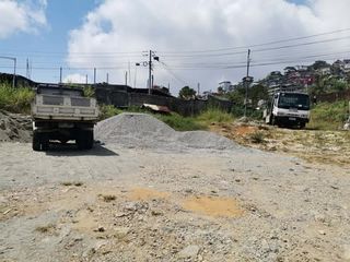 Flat Land 1000 sq.m fully fenced off Naguilian Road ideal for Warehouse, trucks parking/mix use property